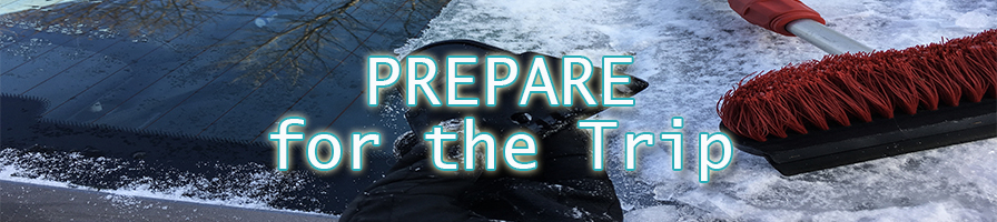 Vehicle windshield covered in ice and snow with scraper on it - Prepare for the trip